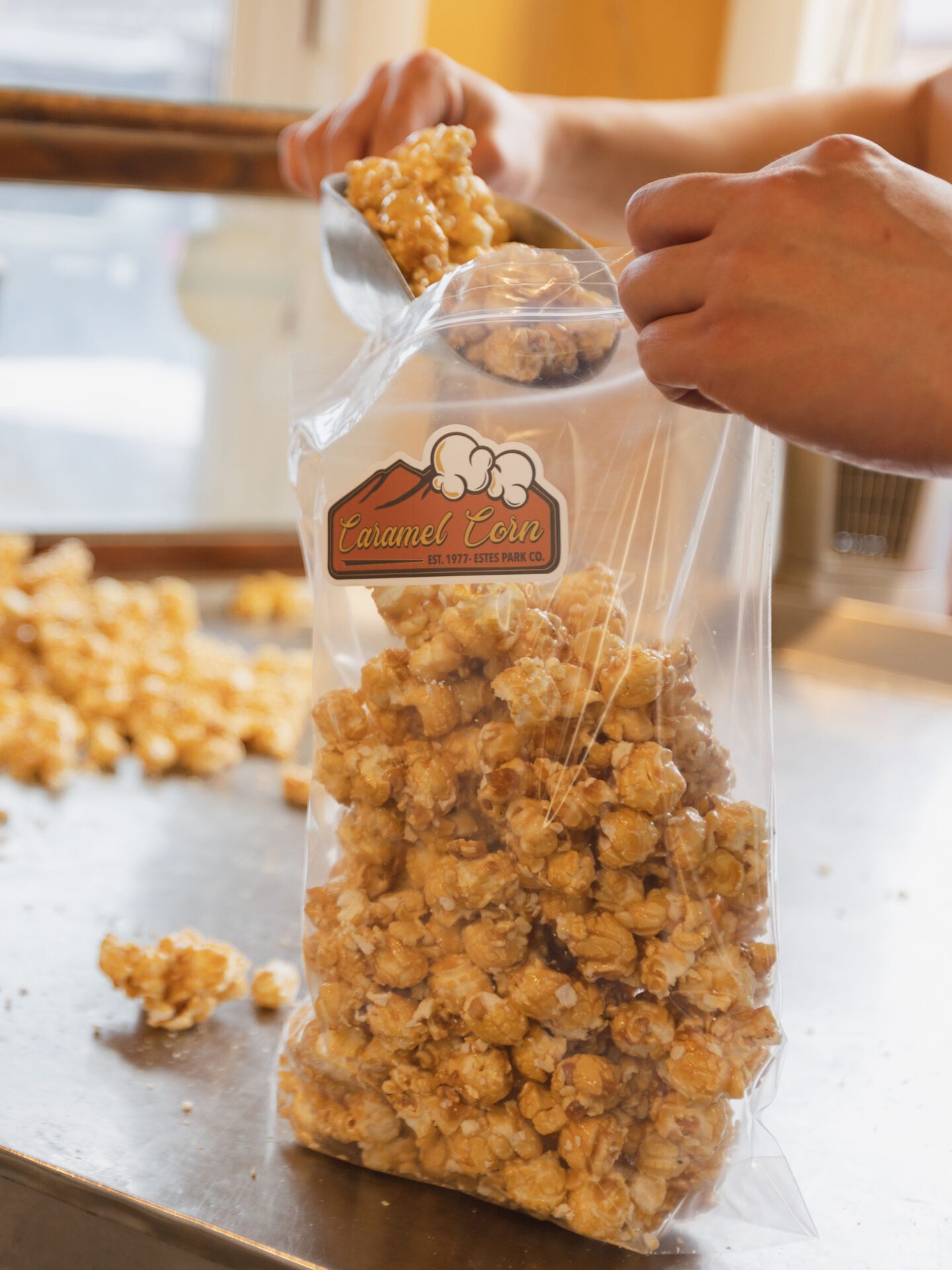 Caramel Corn going into a bag