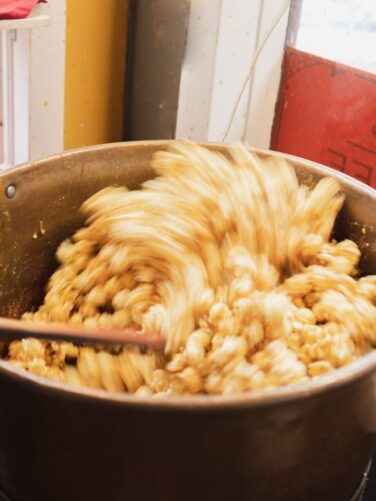 Caramel Corn stirred in kettle